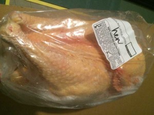Frozen hen packaged in a loose fitting, lightweight bag. Notice the ice formation and drying out.